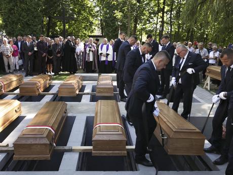 Poland holds state burial for more than 700 victims of Nazi Germany’s World War II massacres